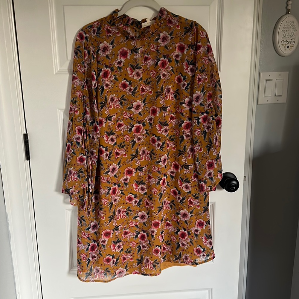 tunic style dress with long sleeves and fitted dress underneath for coverage.